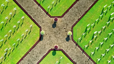 Cemetery pathway with flowers, preparing for a graveside committal service.
