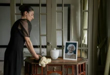 Urn and flowers prepared for a committal service for cremation.