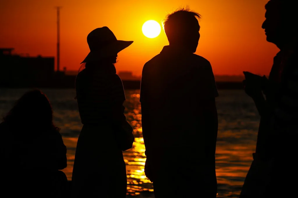 Peaceful sunset representing the end of a cremation committal service.